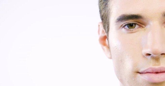 Portrait of a beautiful smiling man showing white teeth looking into camera or making faces of doubt or blunders with perfect skin and combed hair.