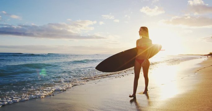 Surfer Girl on the Beach at Sunset