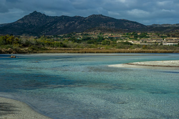 Tavolara with shadow Beach Lu impostu, San Teodoro, Sardinia, Italy