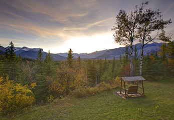 sun setting on mountain range