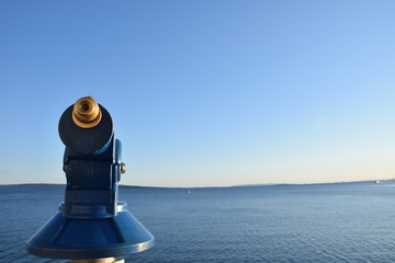 A coin-operated binocular with sea view