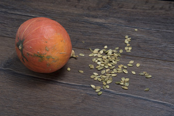 Pumpkin and peeled pumpkin seeds
