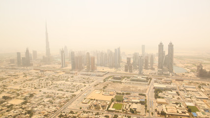 Fototapeta na wymiar Aerial view of the business district of Dubai. Shooting in the summer haze of heat. August 2014. UAE.