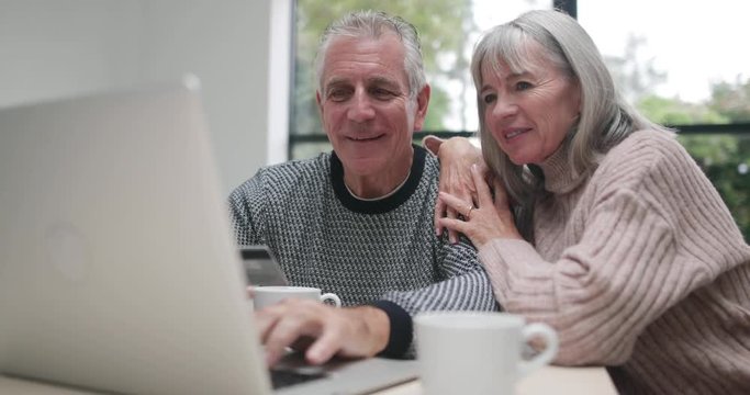 Senior couple online shopping