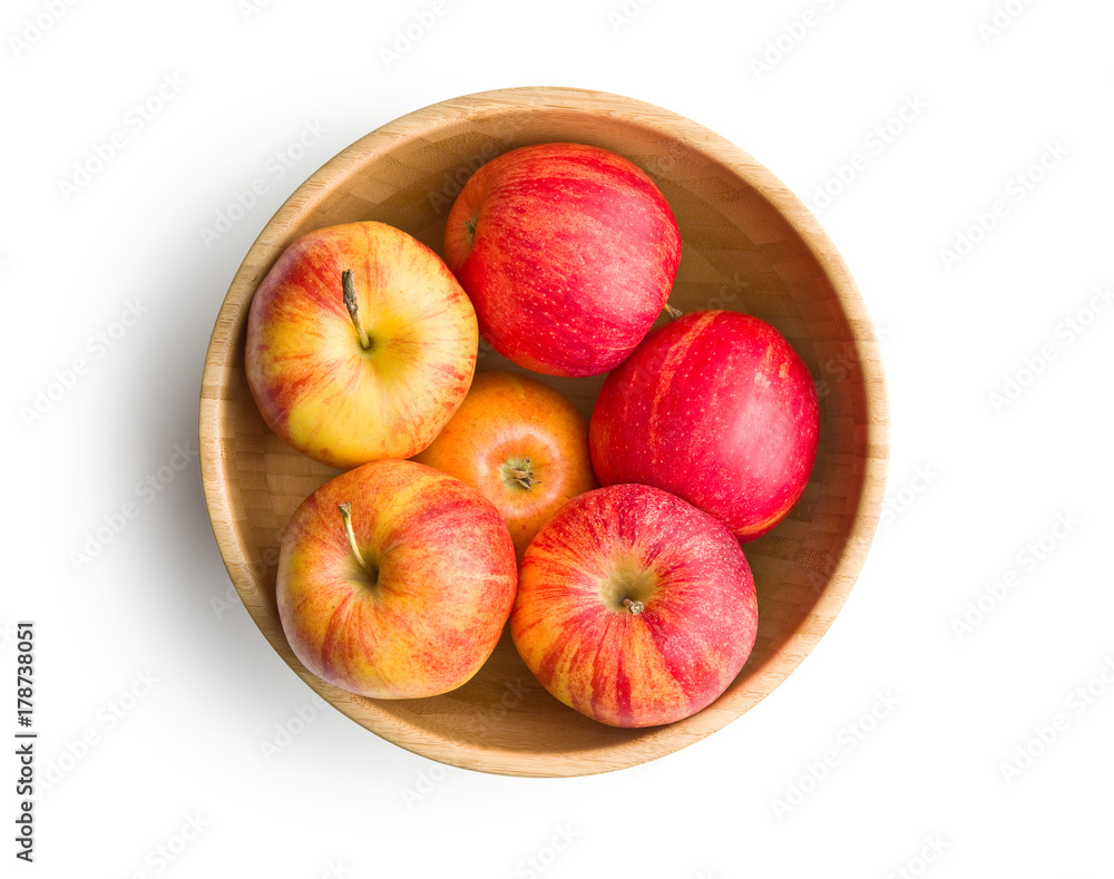 Poster fresh apples in wooden bowl.