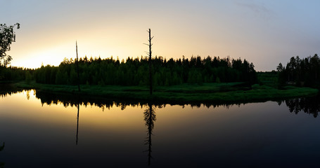 Fototapeta na wymiar Beautiful sunset at the forest river