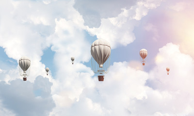 Flying hot air balloons in the air.