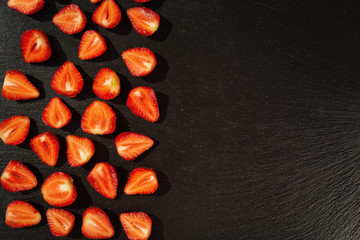 cut strawberries, strawberries in a cut,strawberries in basket, strawberries on wooden table, strawberry, basket with strawberries, strawberries in natural background,fruit concept,fresh strawberry