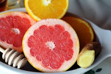 Breakfast table arrangement with grapefruit, orange, lemon and ginger.