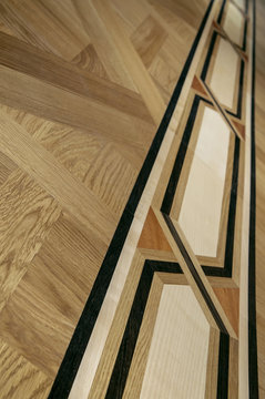 Luxurious wooden parquet with ornamented 