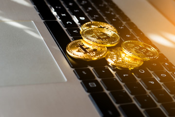 Golden bitcoin on keyboard