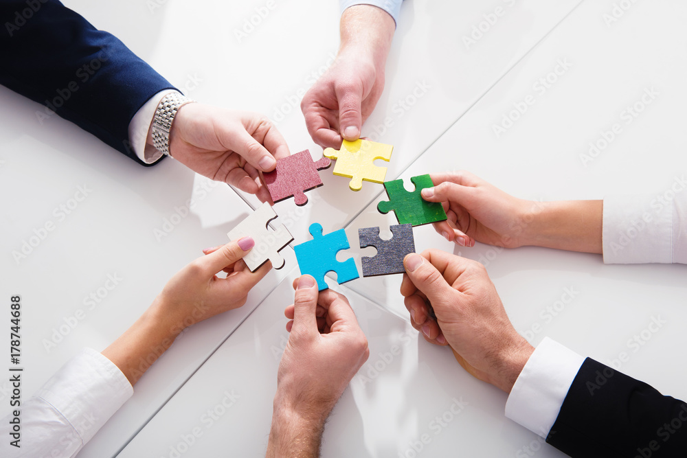 Poster teamwork of partners. concept of integration and startup with puzzle pieces
