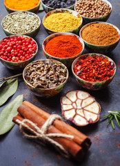 Different spices in bowls on table