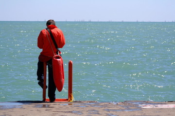 A lifeguard sits along the shore of Lake Michigan in Chicago, Illinois