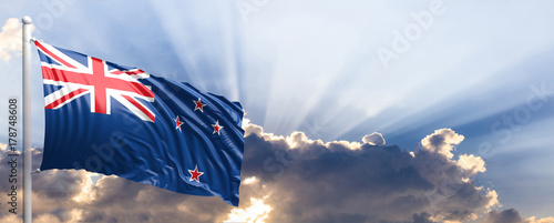 New Zealand flag on blue sky. 3d illustration