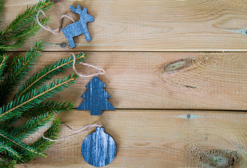 fir branch with wooden Christmas figures