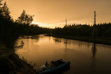 Beautiful sunset at the forest river