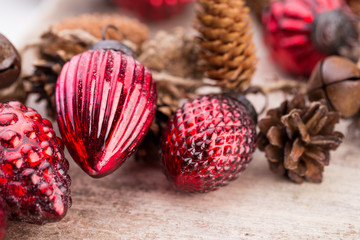 Christmas cone with red berries on a bokeh background.