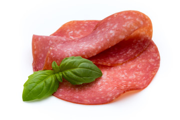 Salami slices isolated on white background.