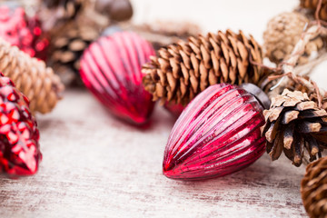 Christmas cone with red berries on a bokeh background.