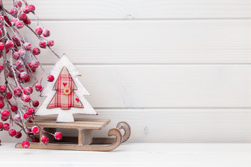 Christmas decor on the wooden white background.