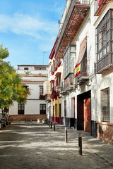 The national flags of Spain hang on the balcony