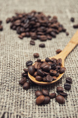 Wooden spoon with coffee beans