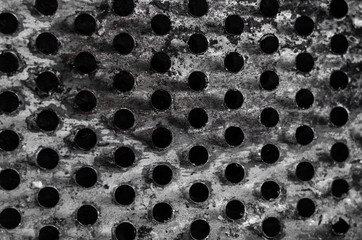 texture of the holes of the old metal float