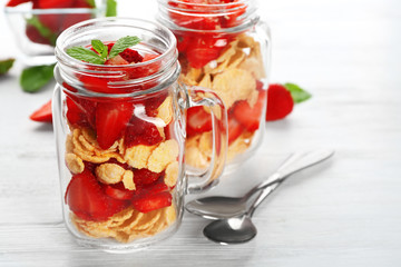 Delicious dessert with fresh strawberry on table