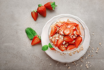 Delicious dessert with fresh strawberry on table