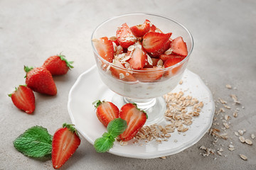 Delicious dessert with fresh strawberry on table