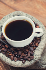 cup of coffee standing on the grains