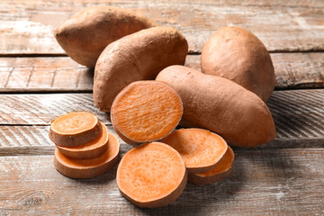 Sweet potatoes on wooden table