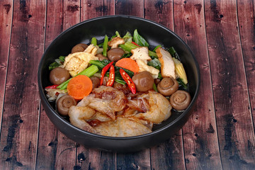 Fried big noodle topped mixed vegetables for organic food.