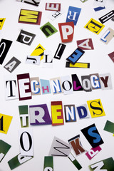 A word writing text showing concept of TECHNOLOGY TRENDS made of different magazine newspaper letter for Business case on the white background with copy space