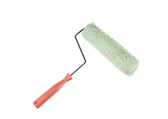 Old roller paint brush on white background
