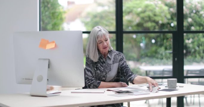 Senior businesswoman working in office