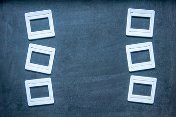 Plastic film slides on chalkboard background