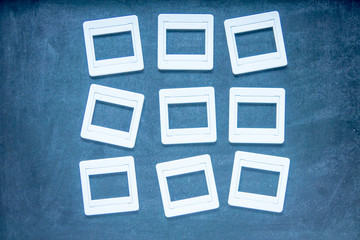 Plastic film slides on chalkboard background