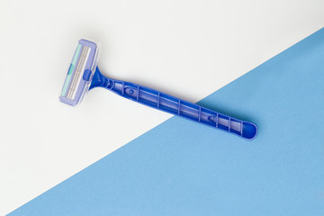 Disposable Razor on a Blue Background