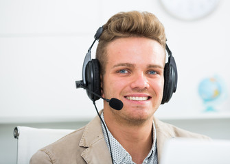 Portrait of male employee with headset