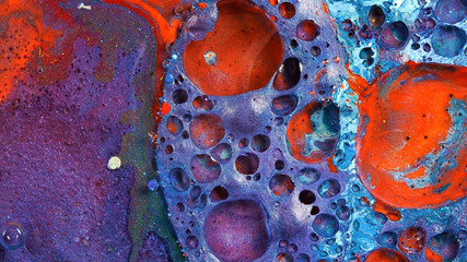 Complex purple and red and blue vibrant bright paint and oil color swirls entropy