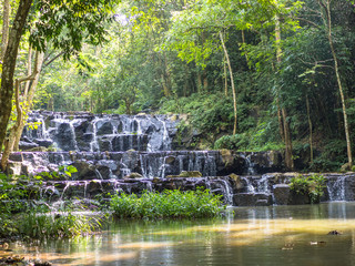 Fototapeta na wymiar Water fall in the green of rain forest.