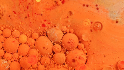 Orange and red creamsicle spheres move 1 vibrant bright paint and oil color swirls entropy