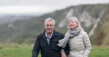 Senior couple walking outdoors - Powered by Adobe