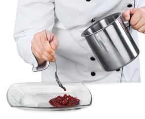 Chef putting a sauce on a plate