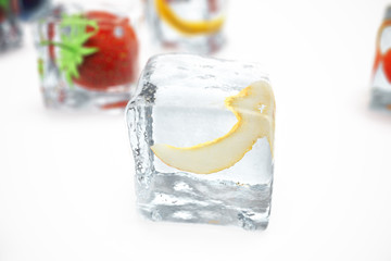 Melon in ice cube isolated on white with depth of field effects. Ice cubes with fresh berries. Berries fruits frozen in ice cubes, 3D rendering