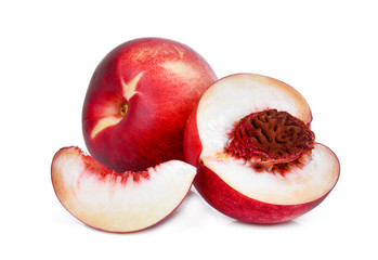 whole and half with slice of nectarine peach fruit isolated on whitie background