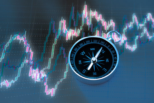 Candlestick chart graphic and black compass