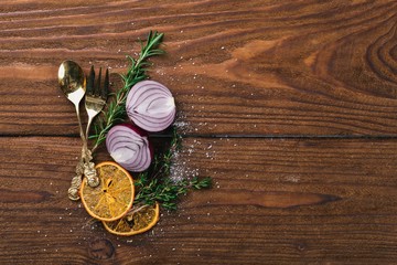 Preparation for cooking. Old cutlery. On a wooden surface. Top view. Free space for your text.